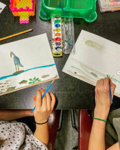 Two students paint