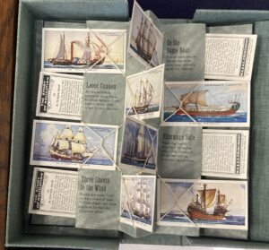 Case of collectible cards with nautical metaphors