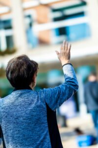 Woman waving goodbye