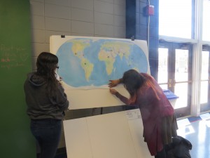 Natasha and Noraya setting up map poster prior before the VA Power Dialogue