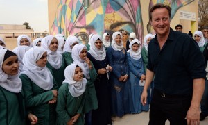 David Cameron meets pupils at a girls school in the town of Zaatari, Jordan, which receives funding from the UK government. One in 13 people in Jordan is a Syrian refugee. Photograph: Stefan Rousseau/Pool/Getty Images
