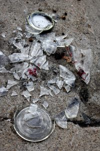broken-glass-jar-on-sidewalk