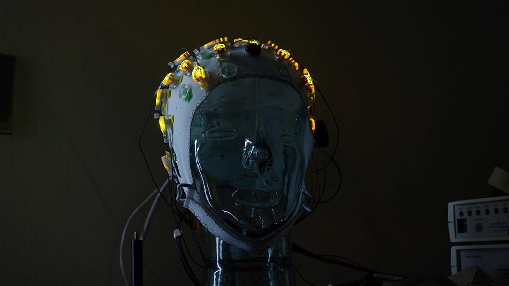 lit up electrodes on cap in a dark room