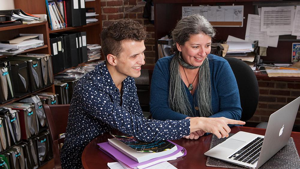 dr. bukach with a student working at computer