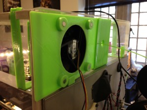 Rear view of the exhaust fan assembly, showing the modified 3D-printed sheet instead of a piece of plexiglass. The fan and filter is held on inductively by magnets.