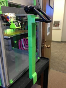 The Logitech 9000 USB webcam has an adjustable arm that I used to stuff into the end of the mounting bracket for the monopod. The top can also take a 1/4-20 to attached other cameras.